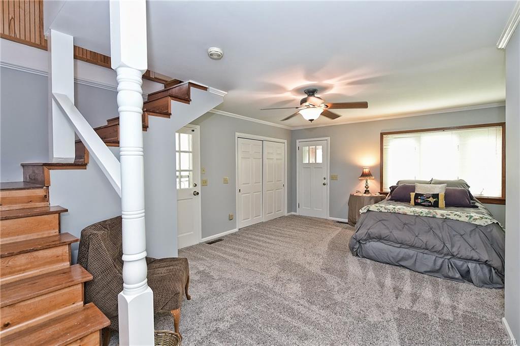 4917 Morgan Mill Road Monroe, NC 28110 - Photo 25 of 36 a living room with furniture and a chandelier