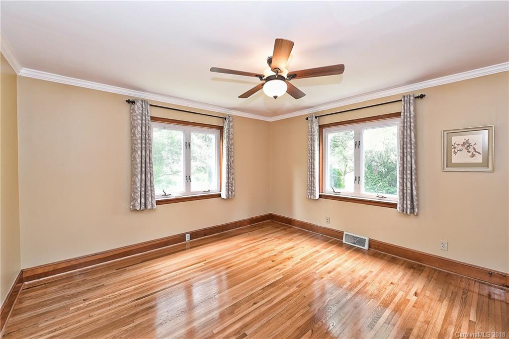 4917 Morgan Mill Road Monroe, NC 28110 - Photo 29 of 36 a view of empty room with wooden floor and fan