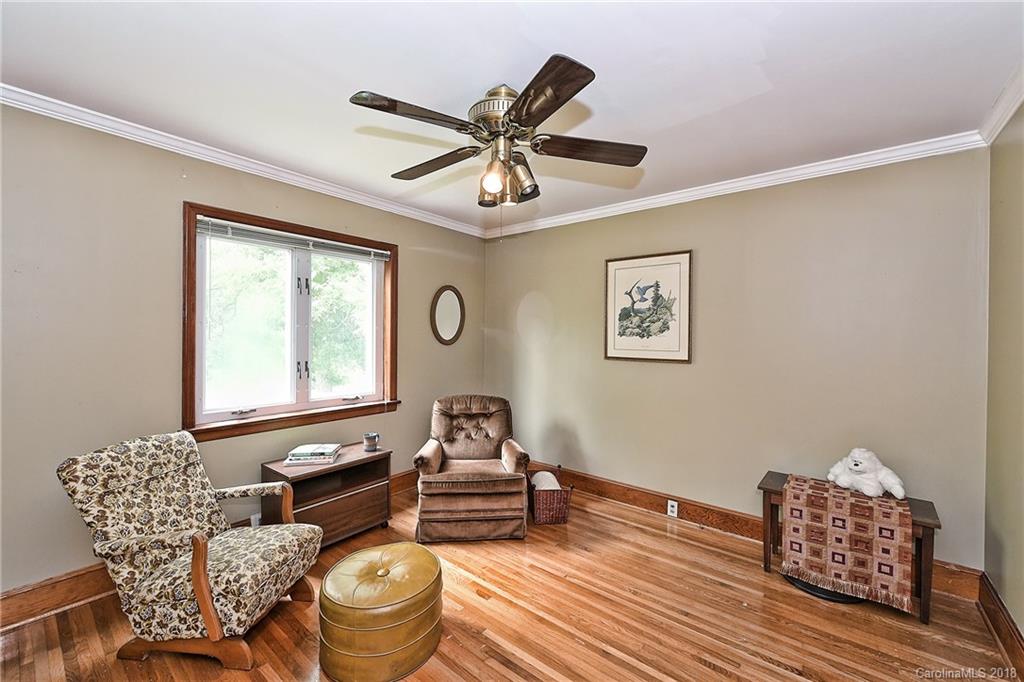 4917 Morgan Mill Road Monroe, NC 28110 - Photo 30 of 36 a living room with furniture and a window