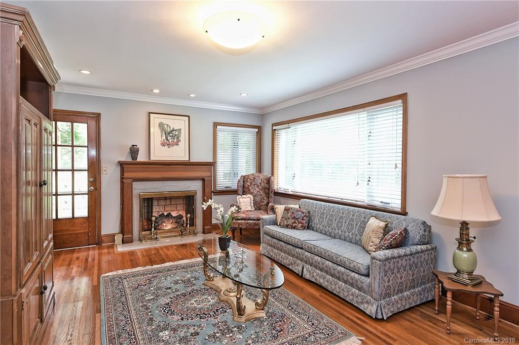 4917 Morgan Mill Road Monroe, NC 28110 - Photo 6 of 36 a living room with furniture and a fireplace