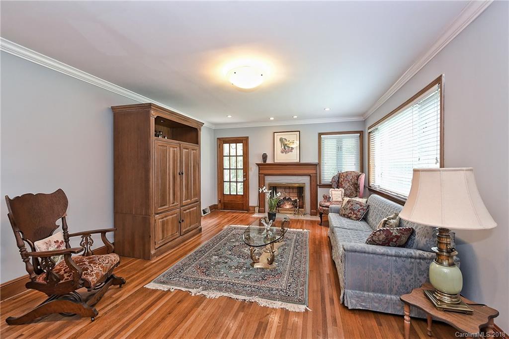 4917 Morgan Mill Road Monroe, NC 28110 - Photo 7 of 36 a living room with furniture and a fireplace