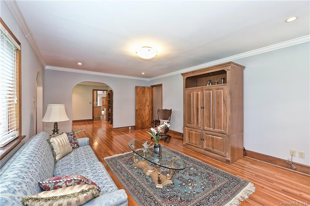 4917 Morgan Mill Road Monroe, NC 28110 - Photo 8 of 36 a living room with furniture and wooden floor
