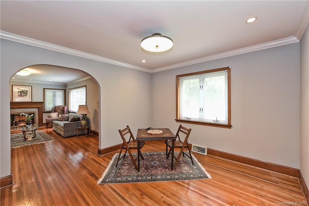 4917 Morgan Mill Road Monroe, NC 28110 - Photo 9 of 36 a living room with furniture and a wooden floor