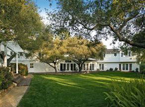 a view of house with a garden
