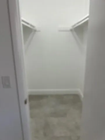 a view of a storage & utility room with a window