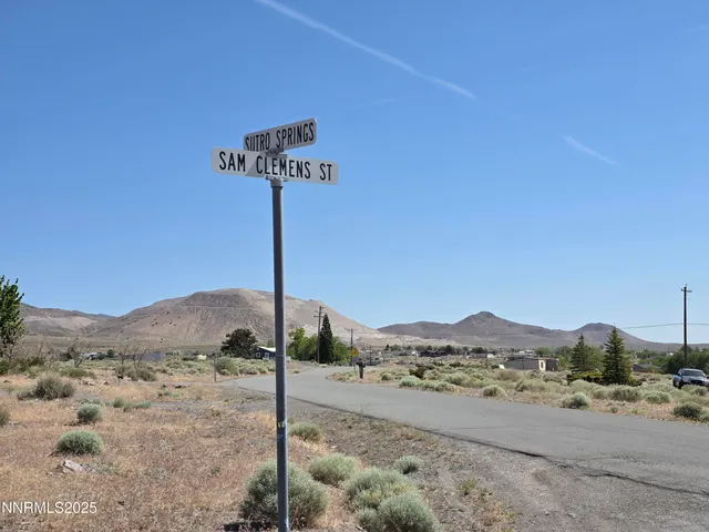 a view of a street with a building in the background