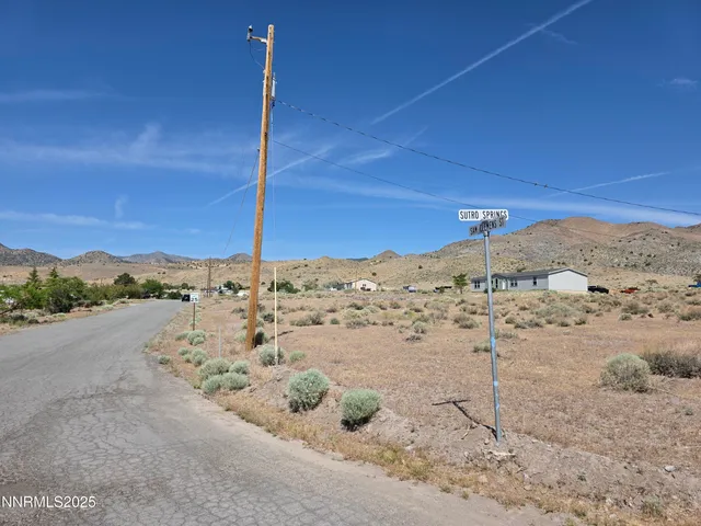 a view of a road with an ocean view