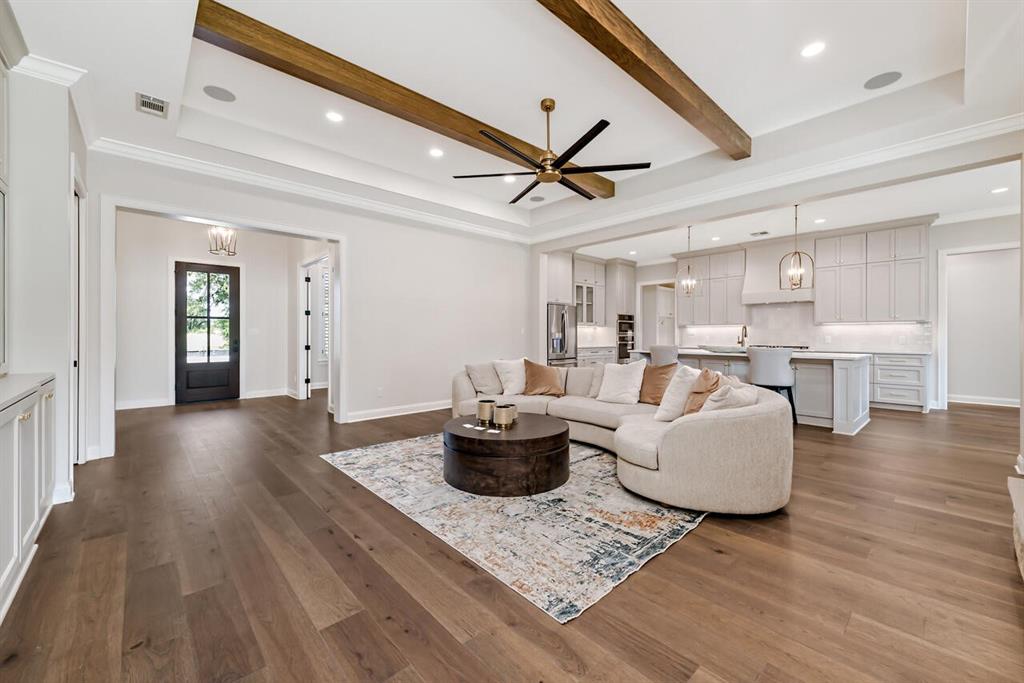 8005 Bee Cave Road China Spring, TX 76633 - Photo 12 of 40 a living room with furniture and a wooden floor