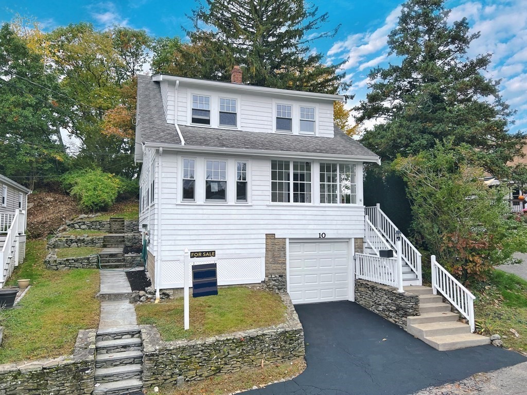 10 Governor Road Arlington, MA 02474 - Photo 1 of 22 a front view of a house with garden