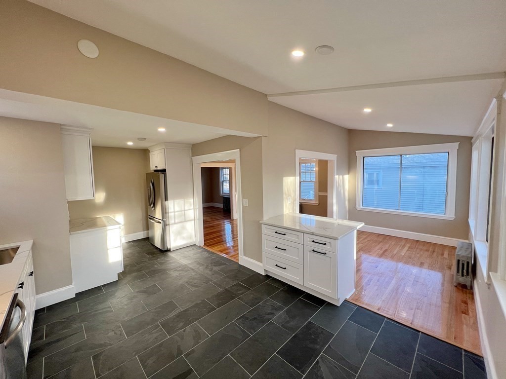 10 Governor Road Arlington, MA 02474 - Photo 12 of 22 a open kitchen with white cabinets and stainless steel appliances