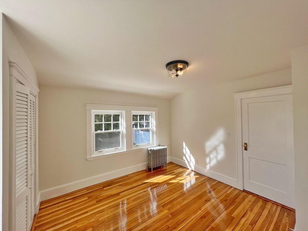 10 Governor Road Arlington, MA 02474 - Photo 16 of 22 a bedroom with a bed and a window