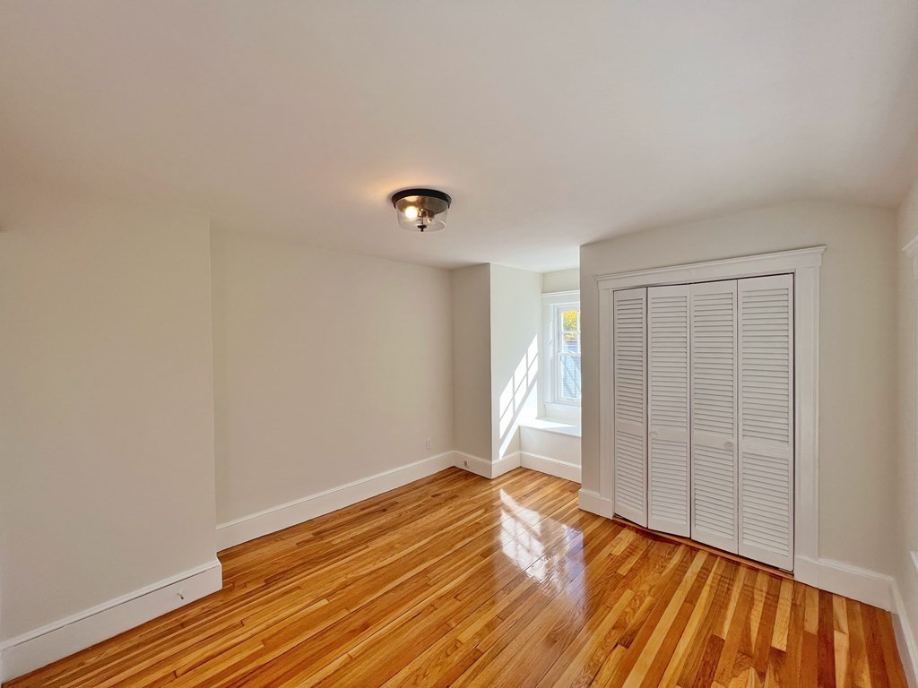 10 Governor Road Arlington, MA 02474 - Photo 17 of 22 a view of empty room with wooden floor