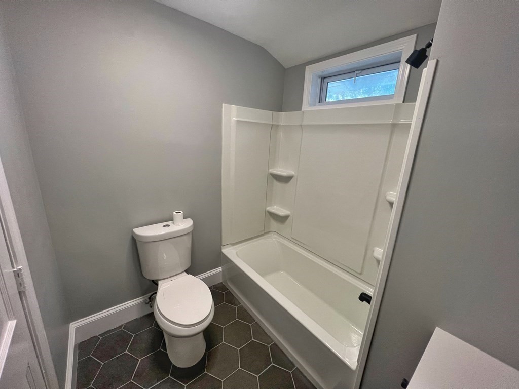 10 Governor Road Arlington, MA 02474 - Photo 21 of 22 a bathroom with a toilet and a shower