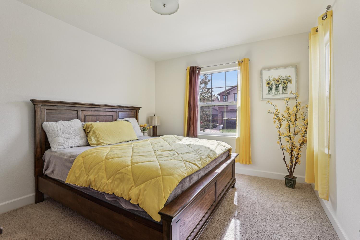 2371 Rio Grande Drive Tracy, CA 95377 - Photo 14 of 61 a bed sitting in a bedroom next to a window and a bathroom