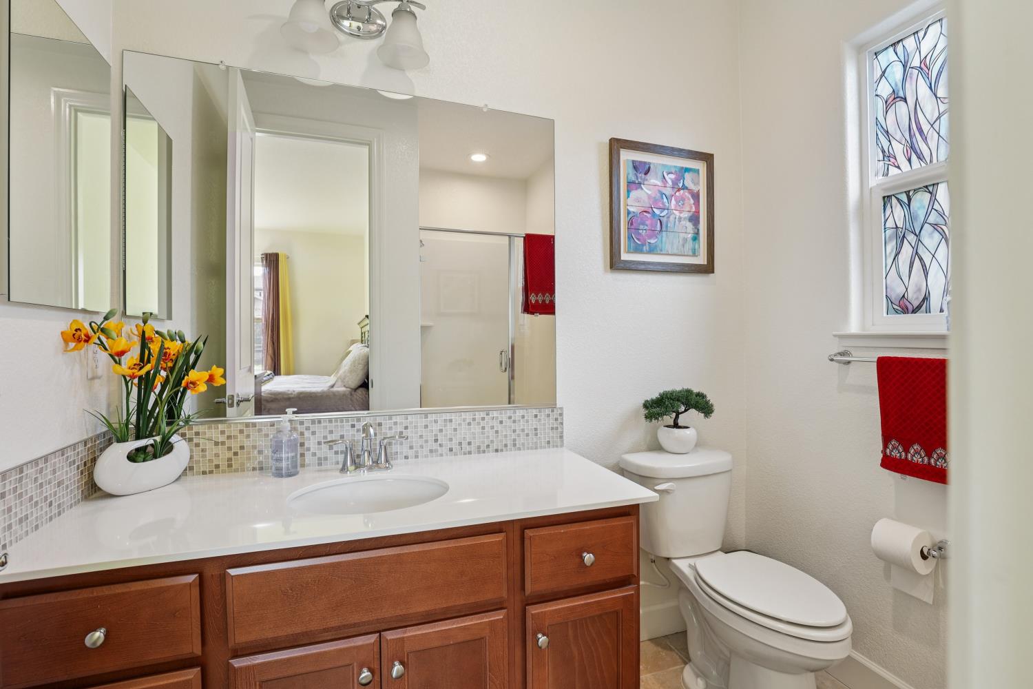 2371 Rio Grande Drive Tracy, CA 95377 - Photo 15 of 61 a bathroom with a granite countertop sink mirror vanity and toilet
