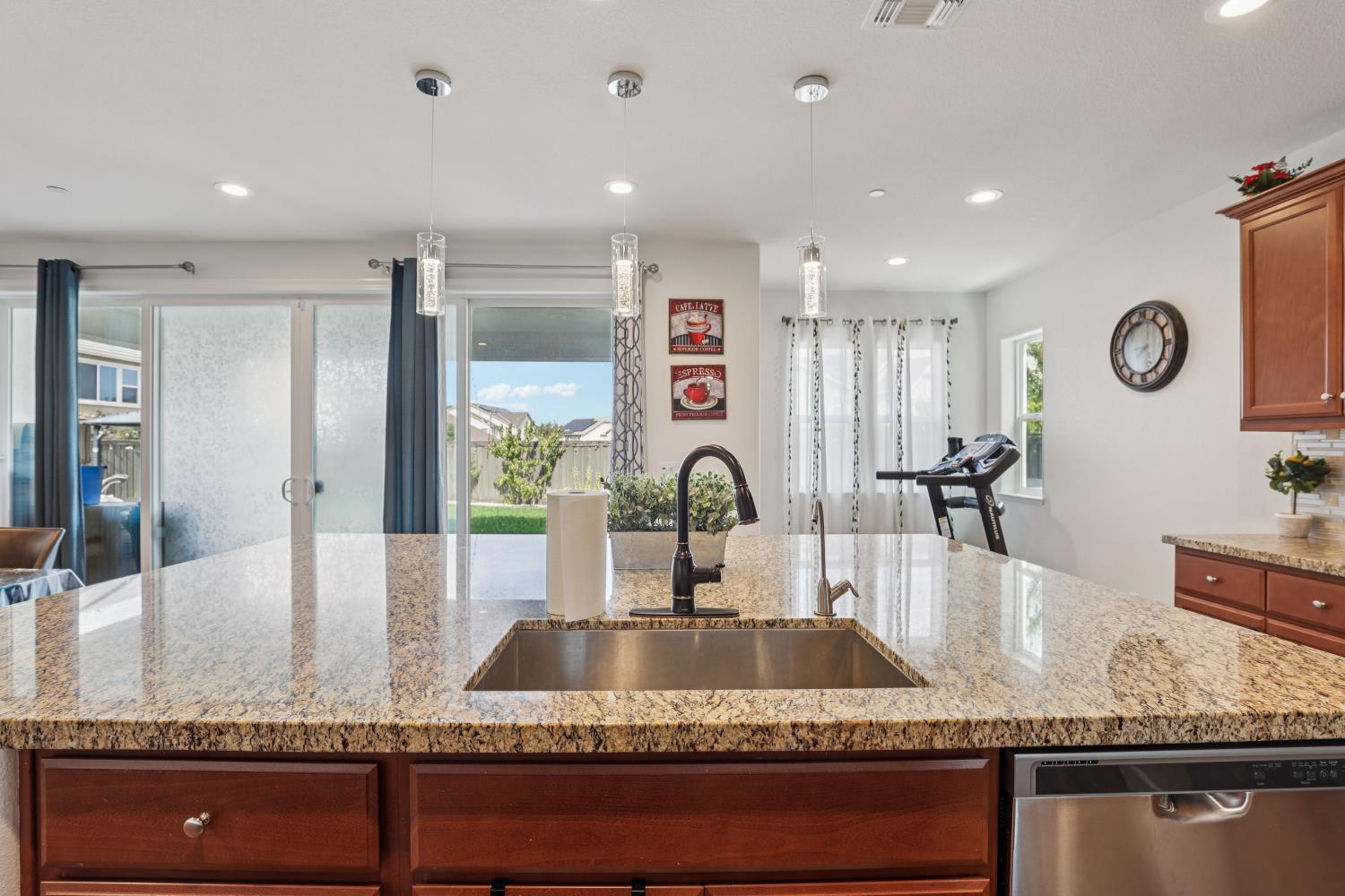 2371 Rio Grande Drive Tracy, CA 95377 - Photo 23 of 61 a kitchen with granite countertop a sink a stove and cabinets