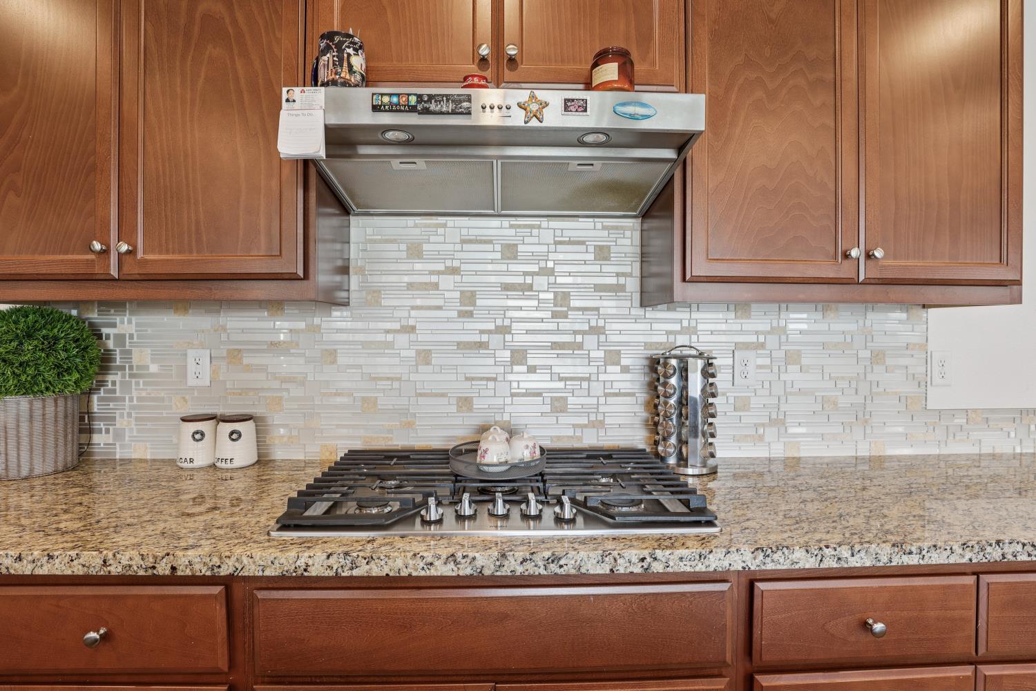2371 Rio Grande Drive Tracy, CA 95377 - Photo 24 of 61 a kitchen with granite countertop a stove and a sink