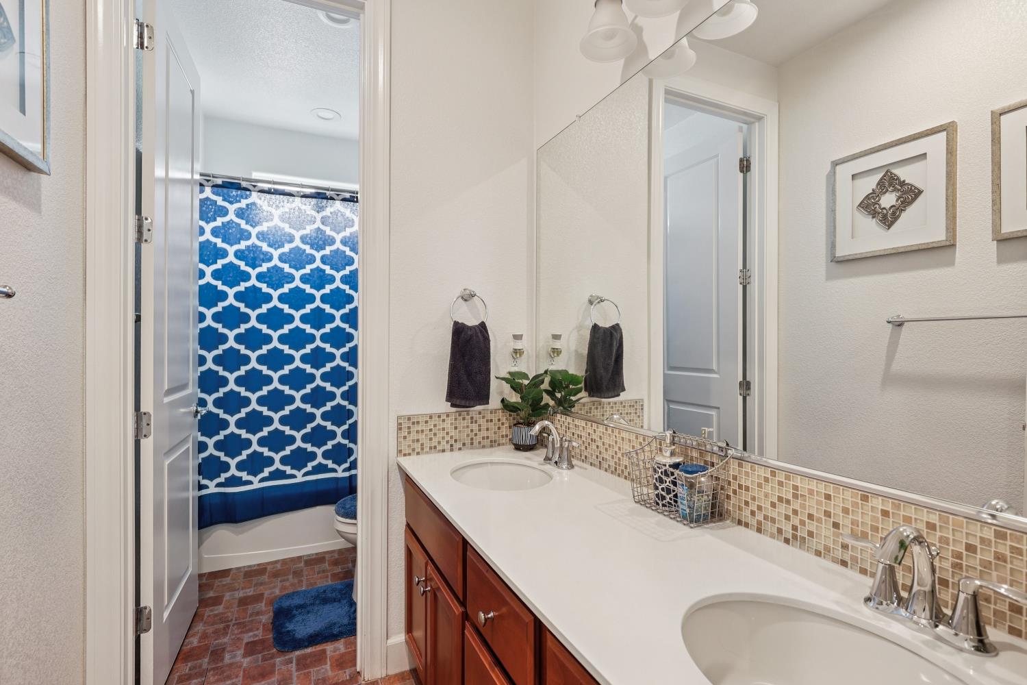 2371 Rio Grande Drive Tracy, CA 95377 - Photo 30 of 61 a bathroom with a sink and a mirror