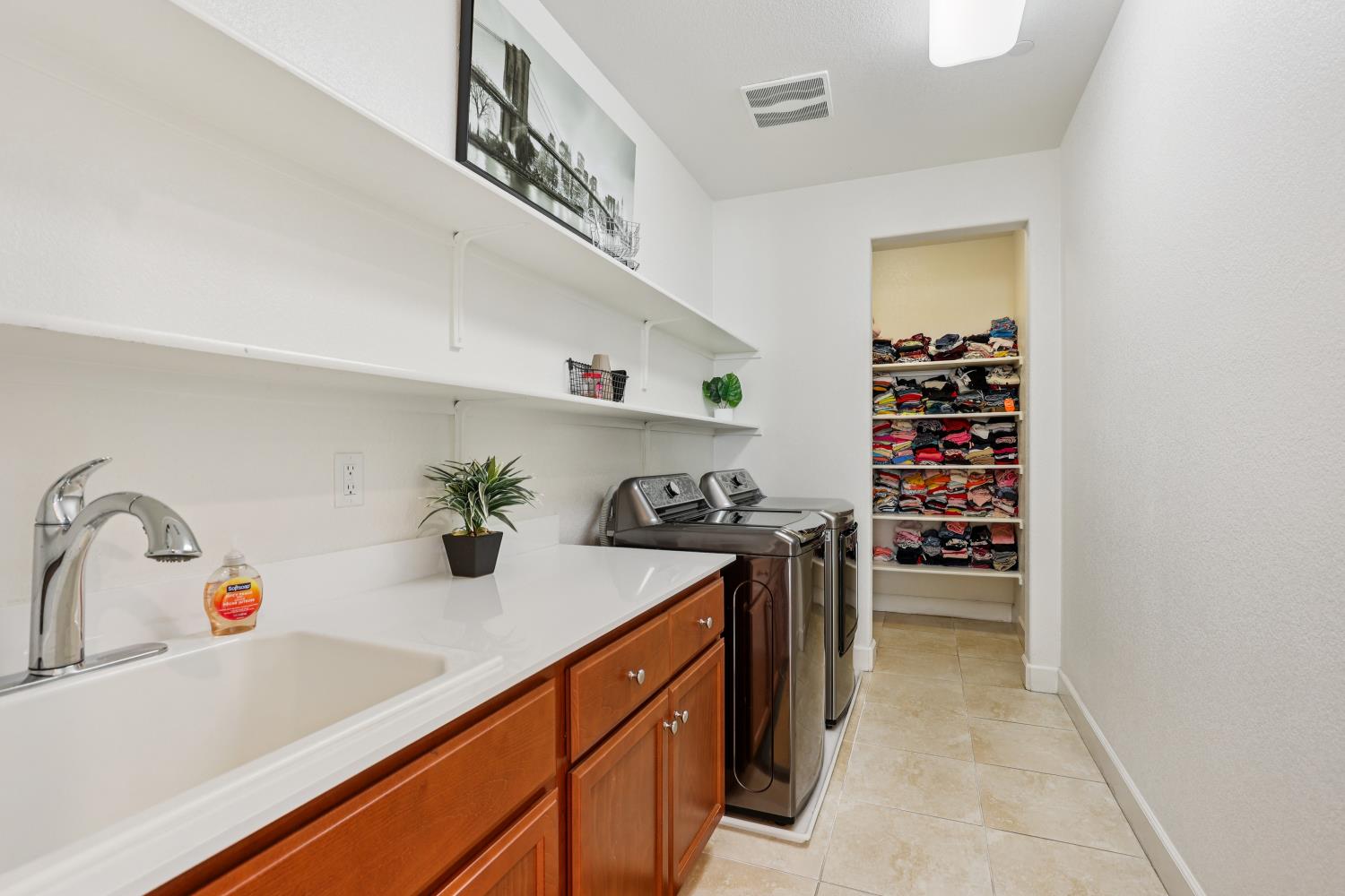 2371 Rio Grande Drive Tracy, CA 95377 - Photo 31 of 61 a kitchen with stainless steel appliances a sink and a stove