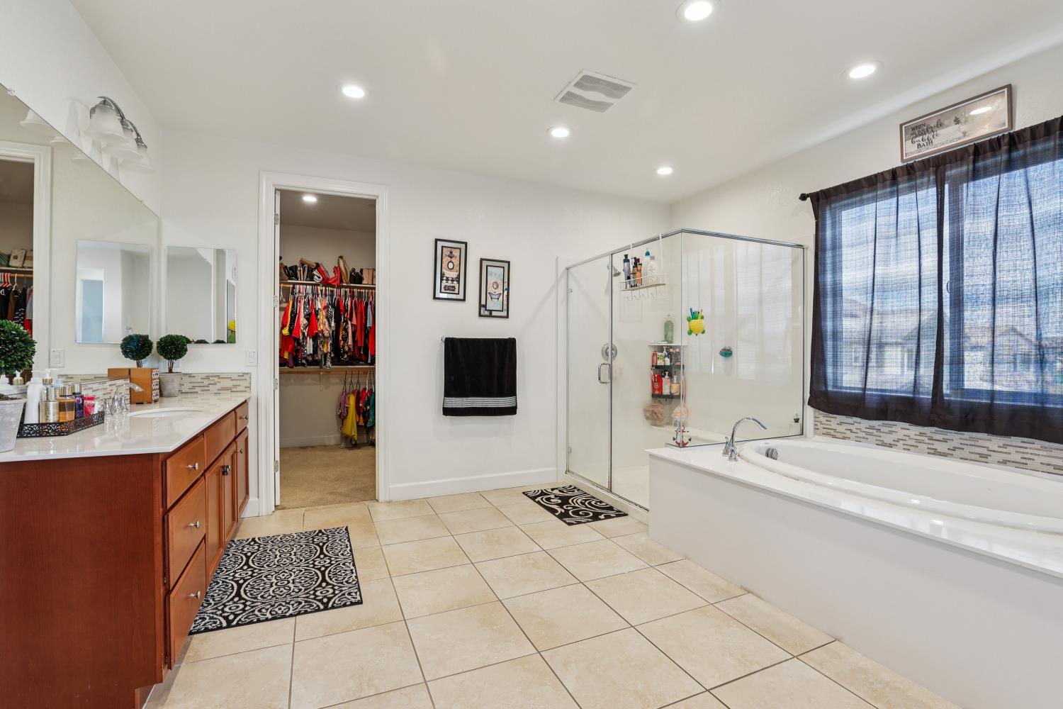 2371 Rio Grande Drive Tracy, CA 95377 - Photo 40 of 61 a spacious bathroom with a tub sink and mirror
