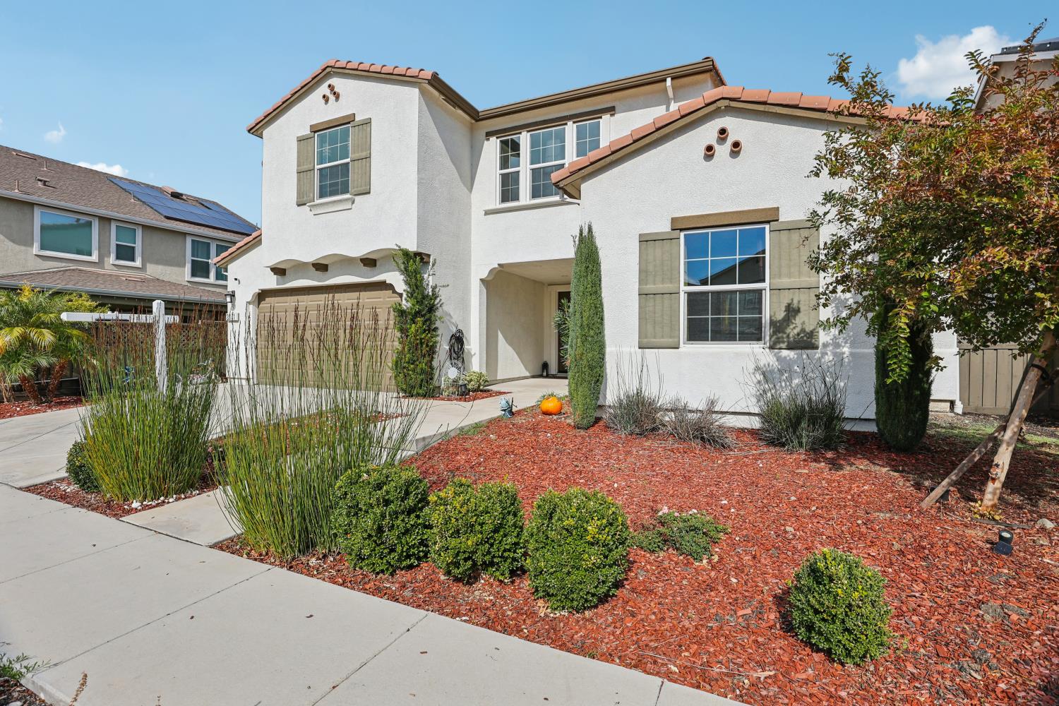 2371 Rio Grande Drive Tracy, CA 95377 - Photo 4 of 61 a front view of a house with a yard and outdoor seating
