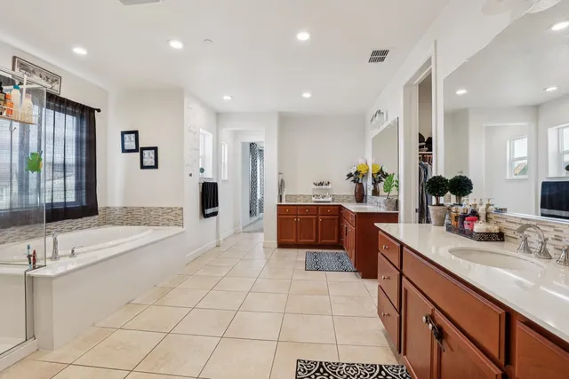 a view of an house with backyard outdoor seating and hardwood