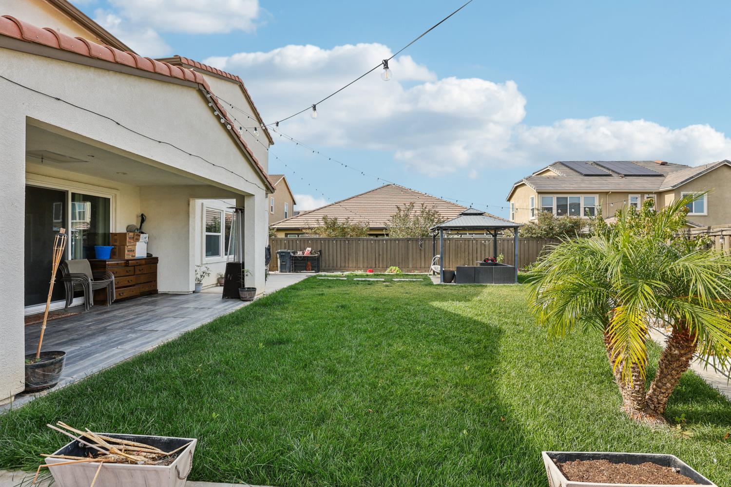 2371 Rio Grande Drive Tracy, CA 95377 - Photo 44 of 61 a view of a house with a big yard plants and large trees
