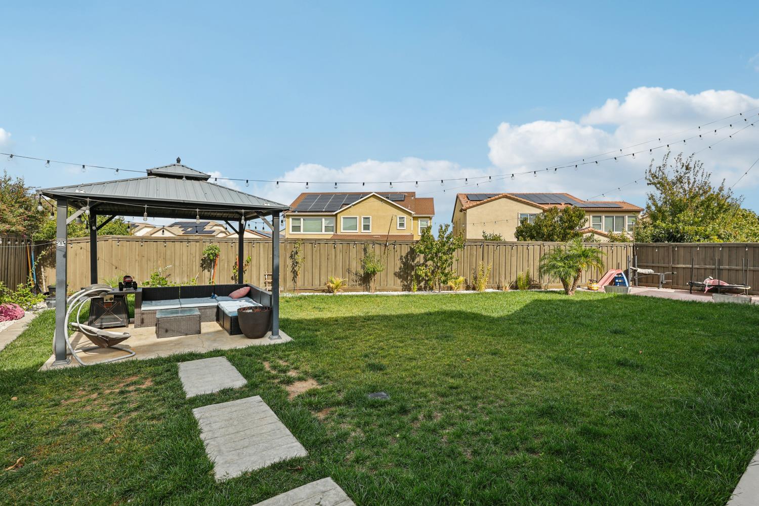 2371 Rio Grande Drive Tracy, CA 95377 - Photo 45 of 61 a view of an house with backyard outdoor seating and hardwood