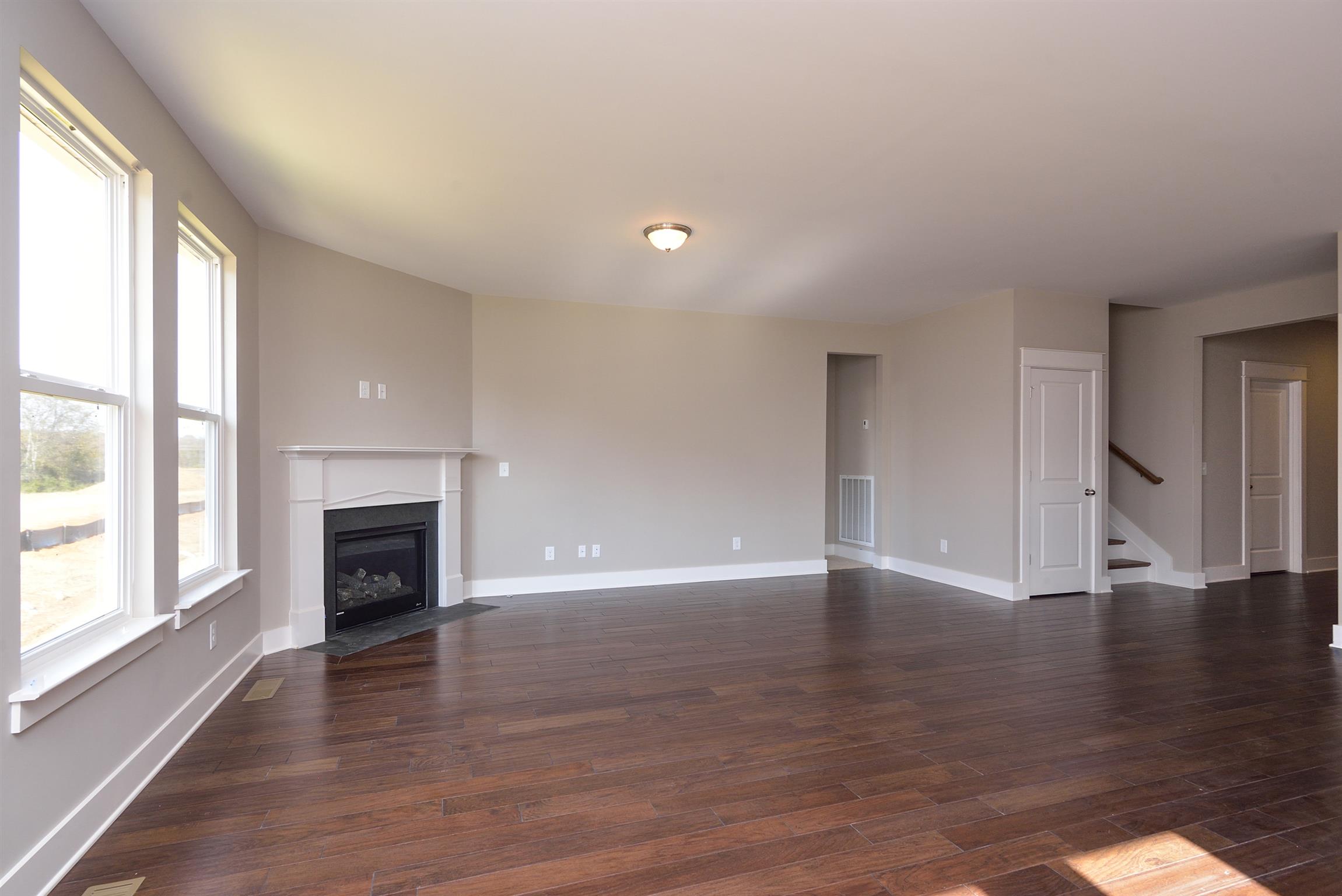 447 Rangeland Road Spring Hill, TN 37174 - Photo 13 of 25 Large Great Room off of the kitchen, with Fireplace. Existing Home.