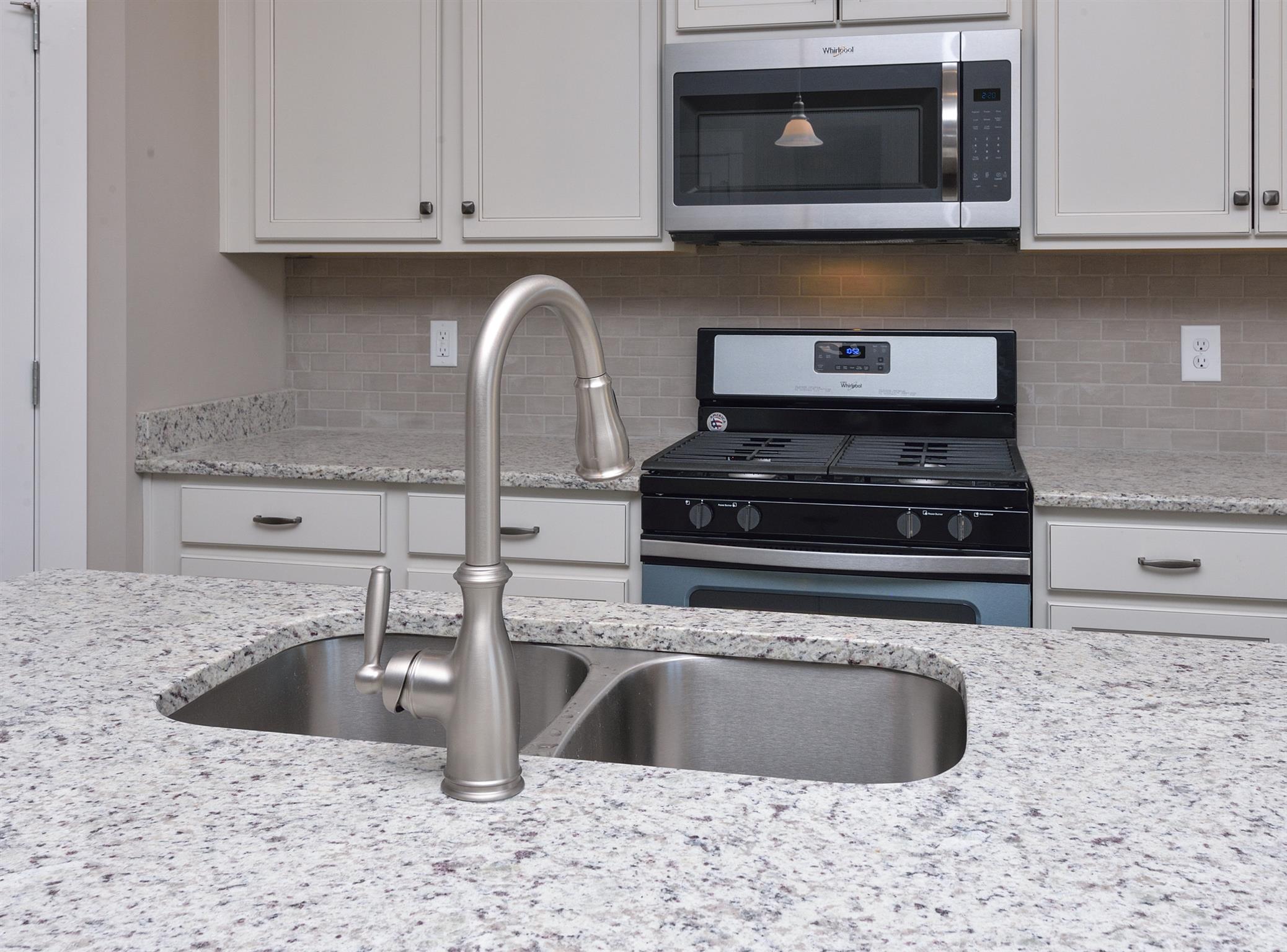 447 Rangeland Road Spring Hill, TN 37174 - Photo 7 of 25 Kitchen view with standard Whirlpool appliances.