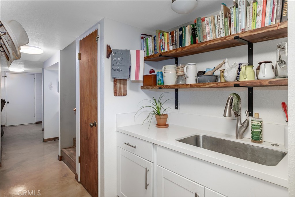 1228 7th Street Los Osos, CA 93402 - Photo 20 of 44 a kitchen with refrigerator and cabinets