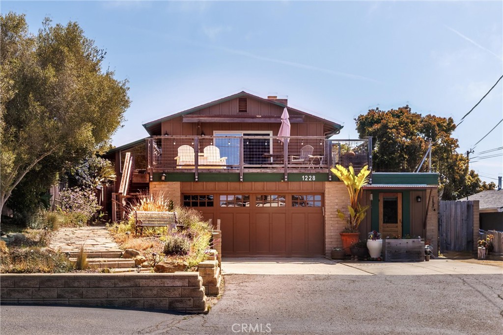 1228 7th Street Los Osos, CA 93402 - Photo 2 of 44 a front view of a house with a yard