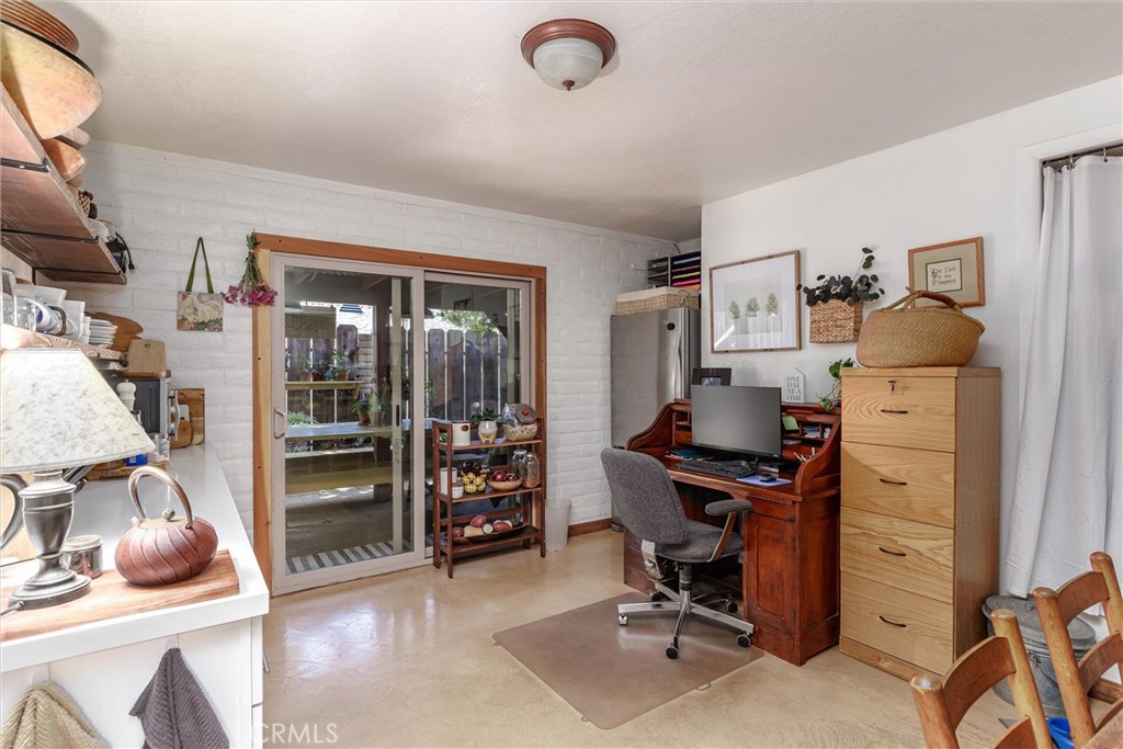 1228 7th Street Los Osos, CA 93402 - Photo 22 of 44 a view of a workspace with furniture and a window