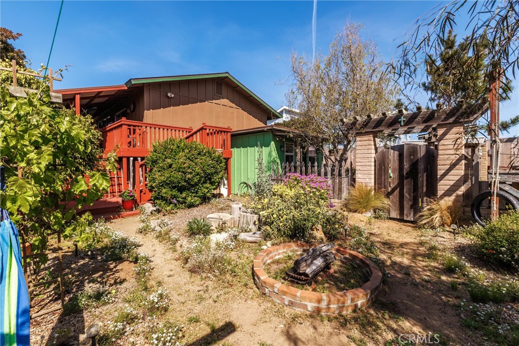 1228 7th Street Los Osos, CA 93402 - Photo 29 of 44 a front view of a house with a yard