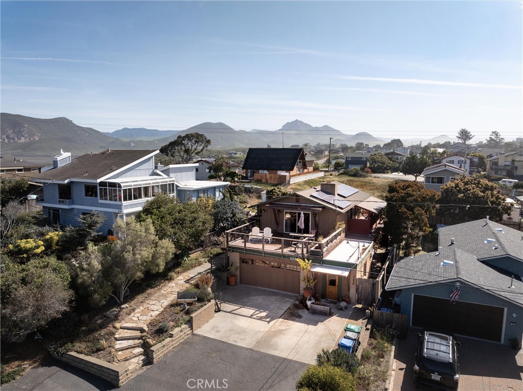 1228 7th Street Los Osos, CA 93402 - Photo 3 of 44 a view of multiple houses with a city street