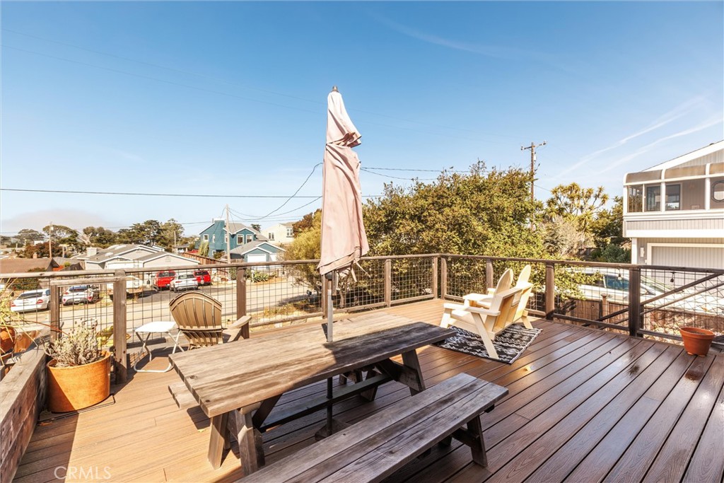 1228 7th Street Los Osos, CA 93402 - Photo 32 of 44 a view of a roof deck with couches and wooden floor
