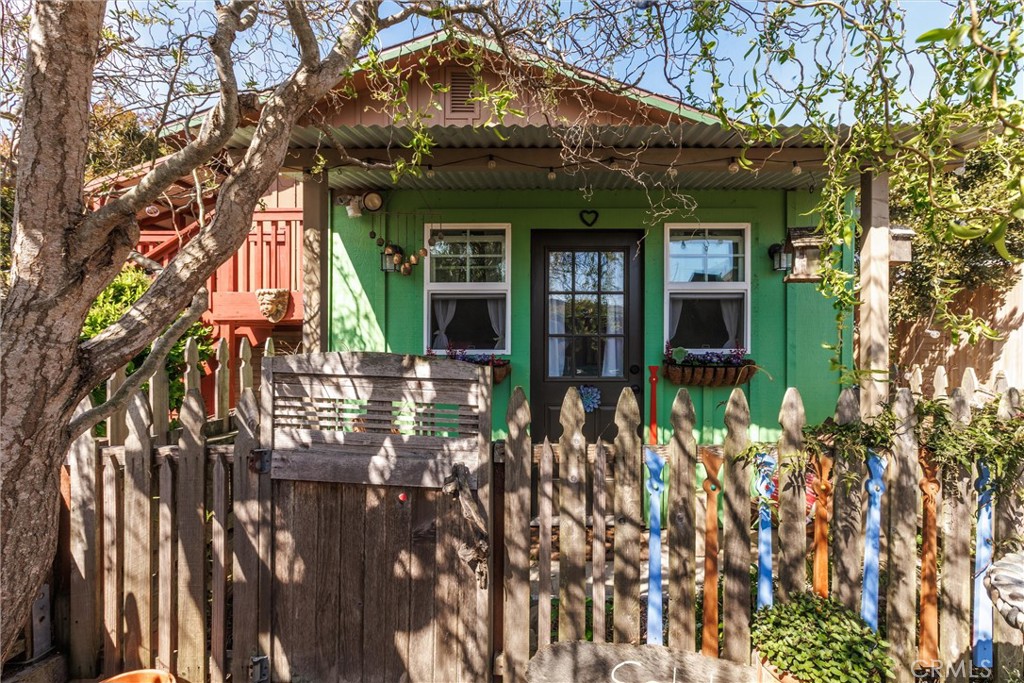 1228 7th Street Los Osos, CA 93402 - Photo 35 of 44 a front view of a house with a tree