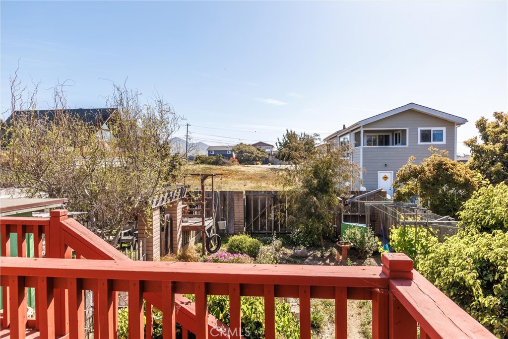 1228 7th Street Los Osos, CA 93402 - Photo 36 of 44 a view of a brick house with a small yard and plants