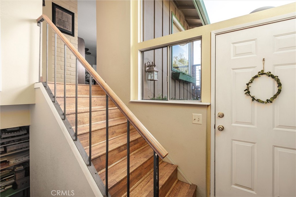 1228 7th Street Los Osos, CA 93402 - Photo 7 of 44 a view of staircase with railing and white walls