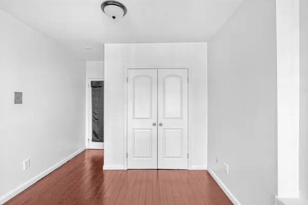 a view of front door with wooden floor
