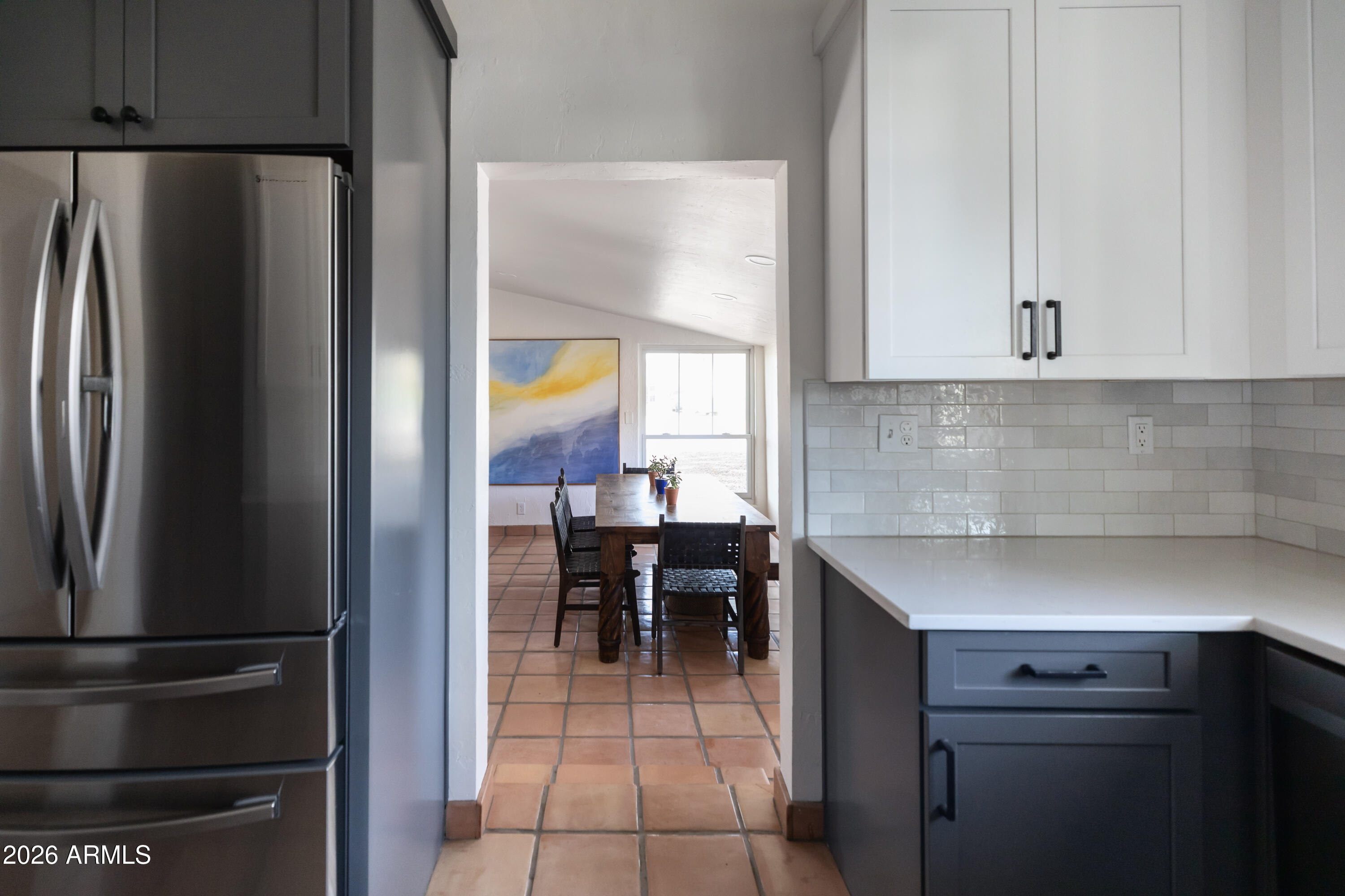 3715 North 9th Place Phoenix, AZ 85014 - Photo 15 of 41 a kitchen with a refrigerator and cabinets