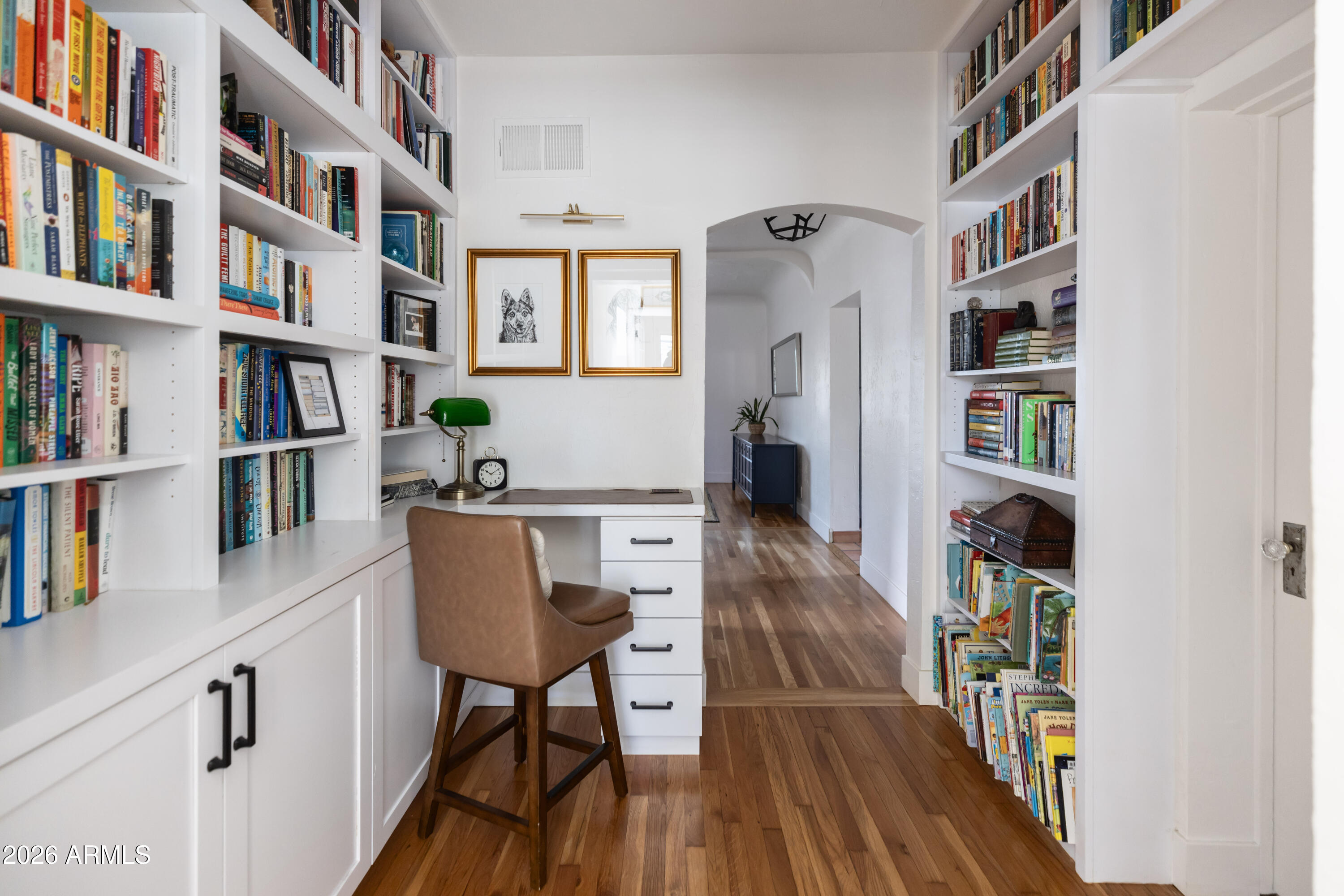 3715 North 9th Place Phoenix, AZ 85014 - Photo 20 of 41 a view of a workspace with bookshelf