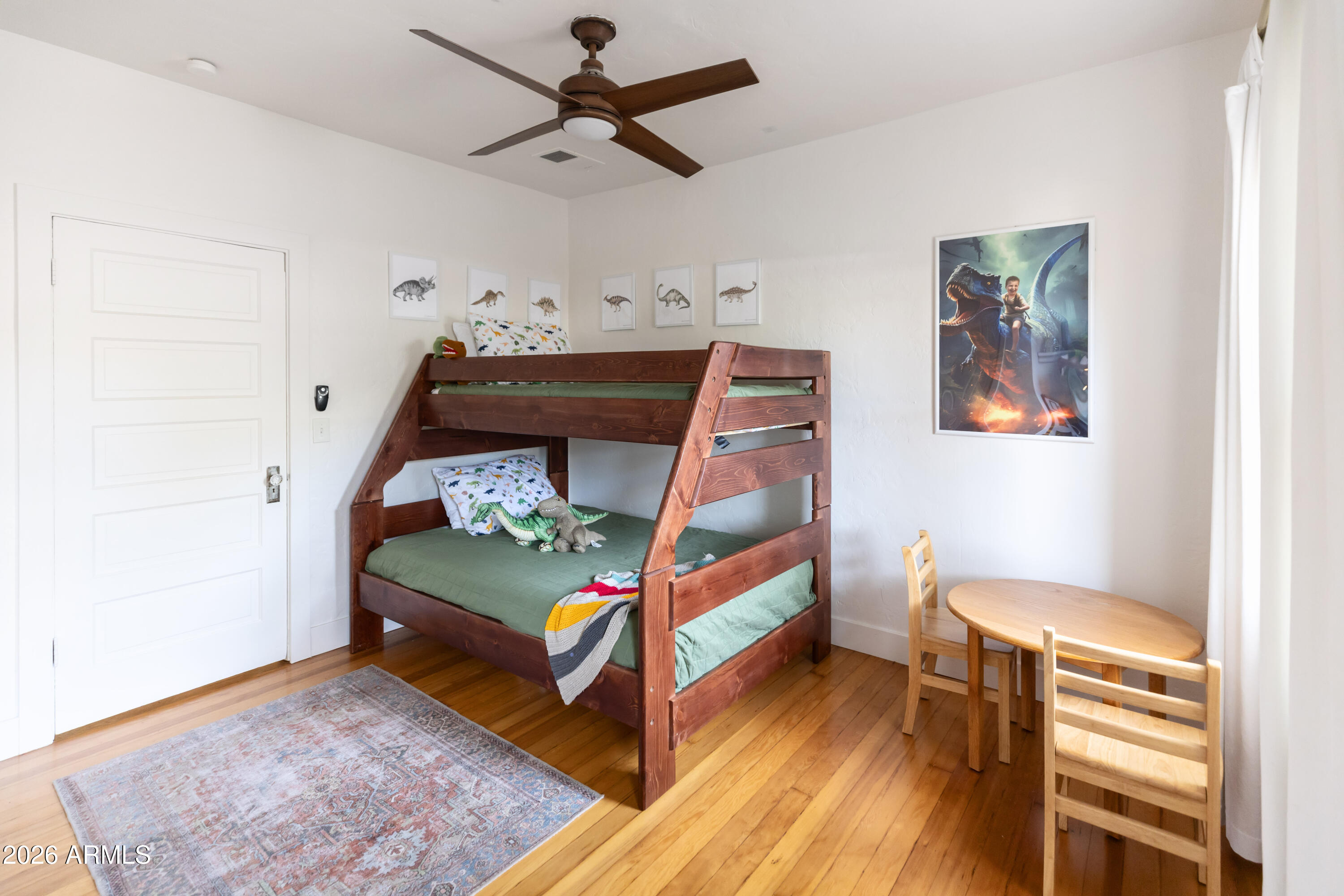 3715 North 9th Place Phoenix, AZ 85014 - Photo 22 of 41 a bedroom with bunk bed and a dresser