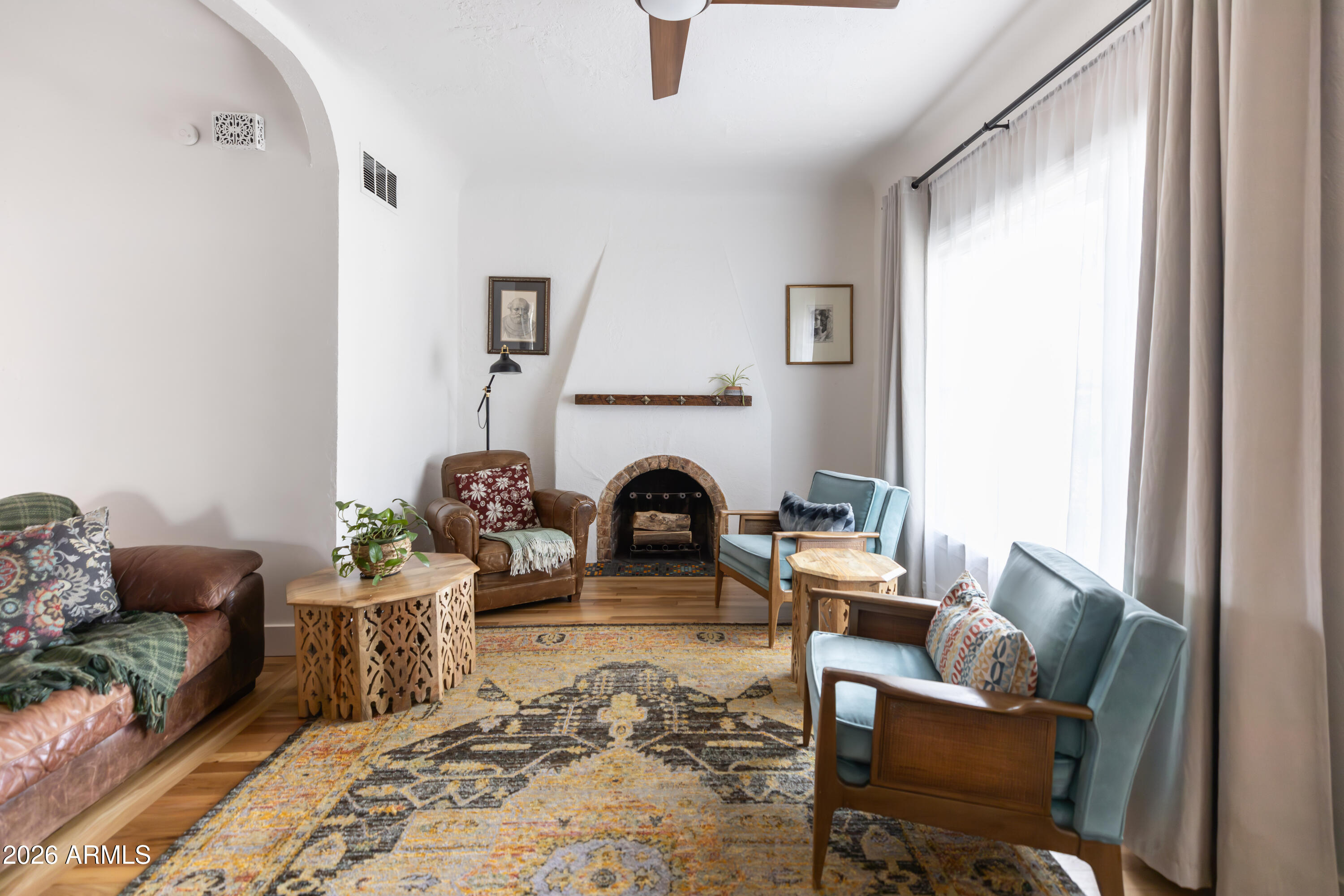 3715 North 9th Place Phoenix, AZ 85014 - Photo 5 of 41 a living room with furniture and a fireplace