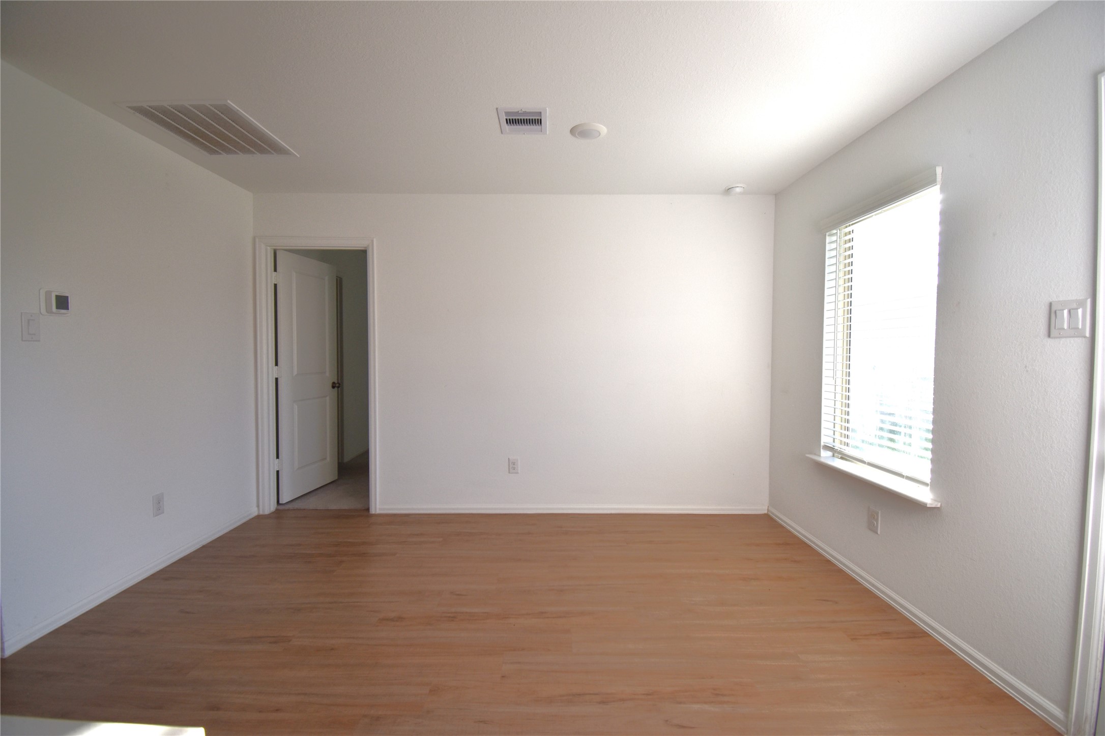 3326 Spanish Oak Lane Rosenberg, TX 77471 - Photo 8 of 24 a view of an empty room with a window