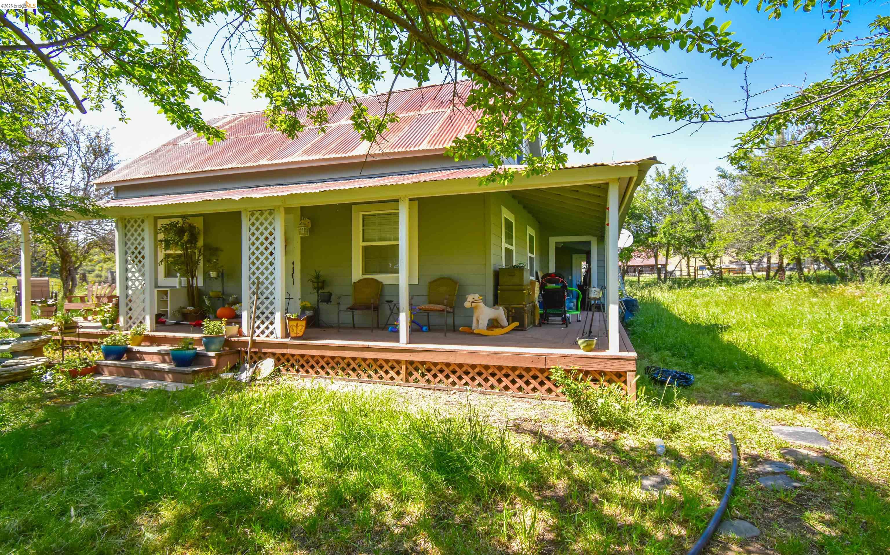9436 Fraguero Road Sonora, CA 95370 - Photo 7 of 18 a front view of a house with a porch