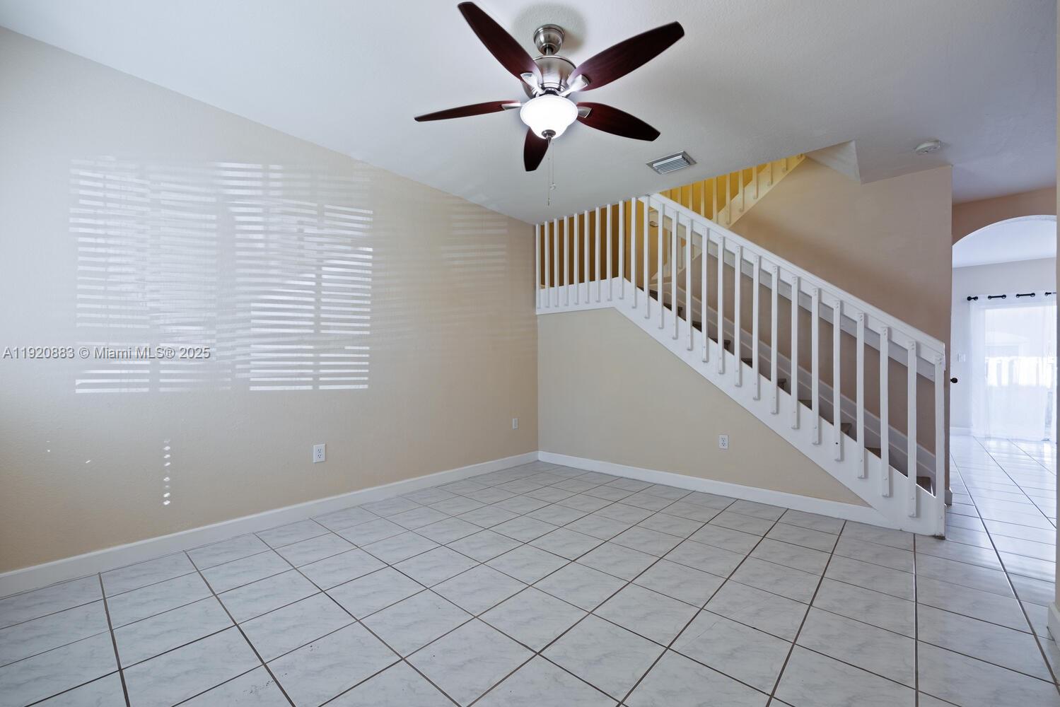8521 Southwest 214th Terrace Cutler Bay, FL 33189 - Photo 2 of 21 a view of an empty room with a window