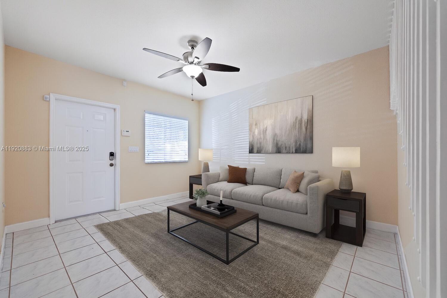8521 Southwest 214th Terrace Cutler Bay, FL 33189 - Photo 4 of 21 a living room with furniture and a window