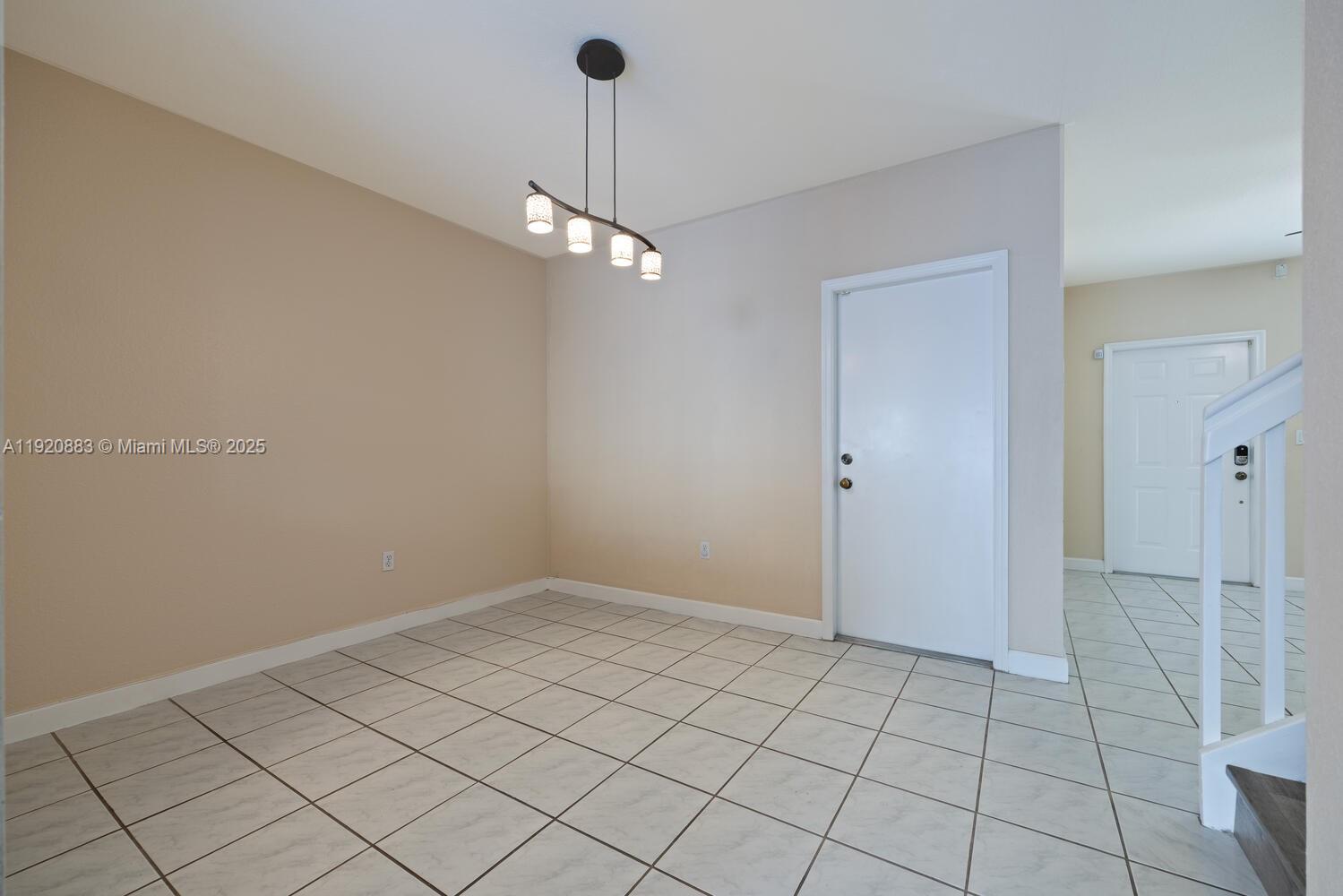 8521 Southwest 214th Terrace Cutler Bay, FL 33189 - Photo 6 of 21 a view of an empty room with a window
