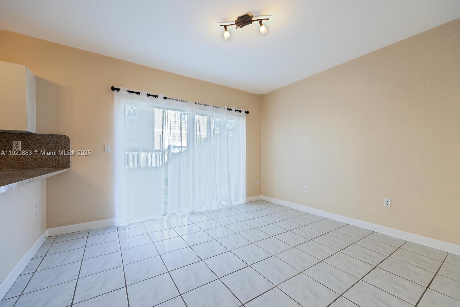 8521 Southwest 214th Terrace Cutler Bay, FL 33189 - Photo 7 of 21 a view of an empty room